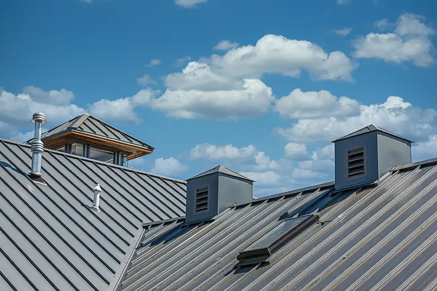 Capital City Roofing & Solar—A metal roof under blue skies in Central IL.
